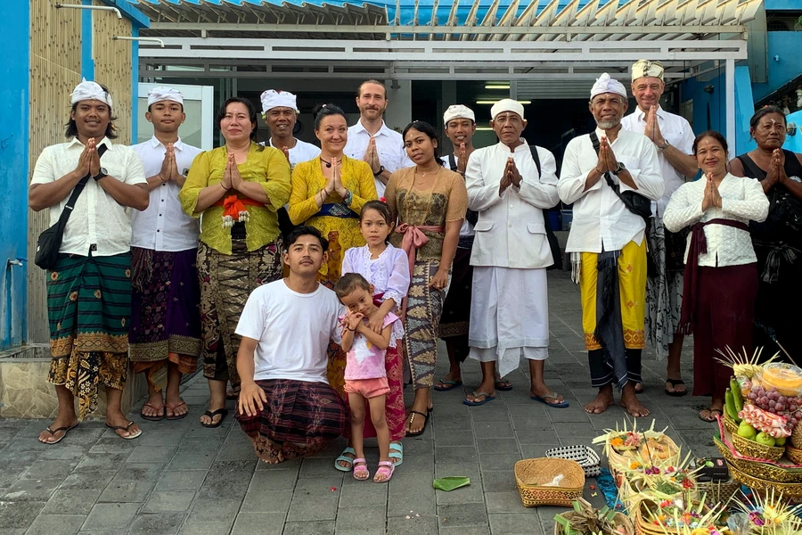 Balinese ceremony photographed respectfully from the background