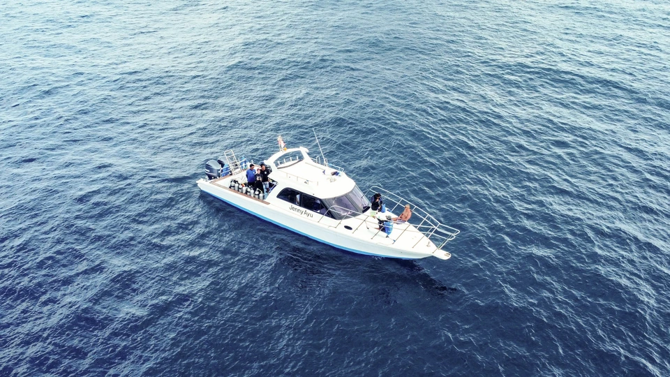 Our speedboat Jenny Ayu with dive equipment and guests off Bali