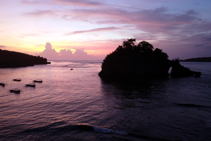 Sunset above a Bali bay as a shared holiday moment